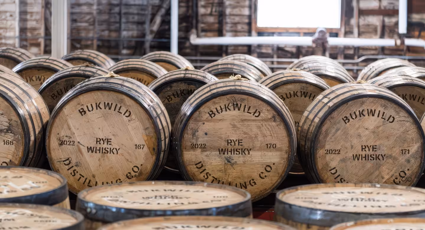 Rows of barrels fills a warehouse